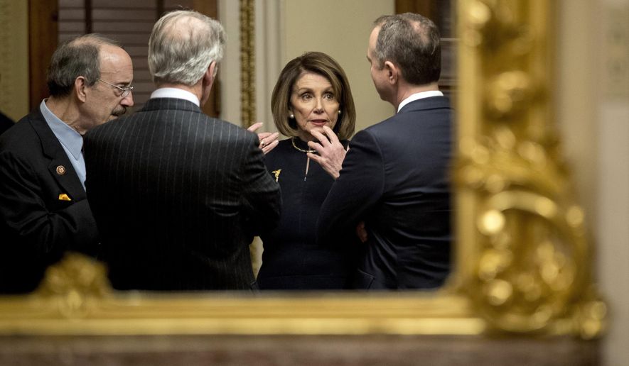 House Speaker Nancy Pelosi of Calif., center, speaks with House Intelligence Committee Chairman Adam Schiff, D-Calif., right, House Foreign Affairs Committee Chairman Eliot Engel, D-N.Y., left, and House Ways and Means Committee Chairman Richard Neal, D-Mass., second from left, in a private room just off the House floor after the House votes to impeach President Donald Trump, Wednesday, Dec. 18, 2019, on Capitol Hill in Washington. (AP Photo/Andrew Harnik)