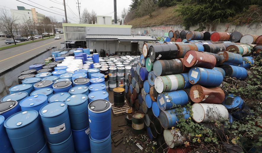 Dozens of barrels fill an outside storage area at Seattle Barrel and Cooperage Wednesday, Dec. 18, 2019, in Seattle. The century-old Seattle barrel company has been indicted along with its third-generation owner in what prosecutors describe as a long-running pollution conspiracy. The 36-count indictment, made public in U.S. District Court in Seattle on Wednesday, says the company used a hidden drain to pump caustic wastewater directly into the King County sewer system. That's despite telling officials that the company reused all its wastewater and didn't discharge any. (AP Photo/Elaine Thompson)