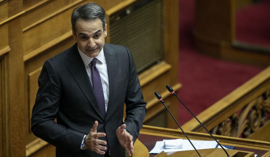 Greece&#x27;s Prime Minister Kyriakos Mitsotakis, delivers a speech during a parliament session in Athens, on Wednesday, Dec. 18, 2019. Greek lawmakers debate on the state budget for 2020. (AP Photo/Yorgos Karahalis)