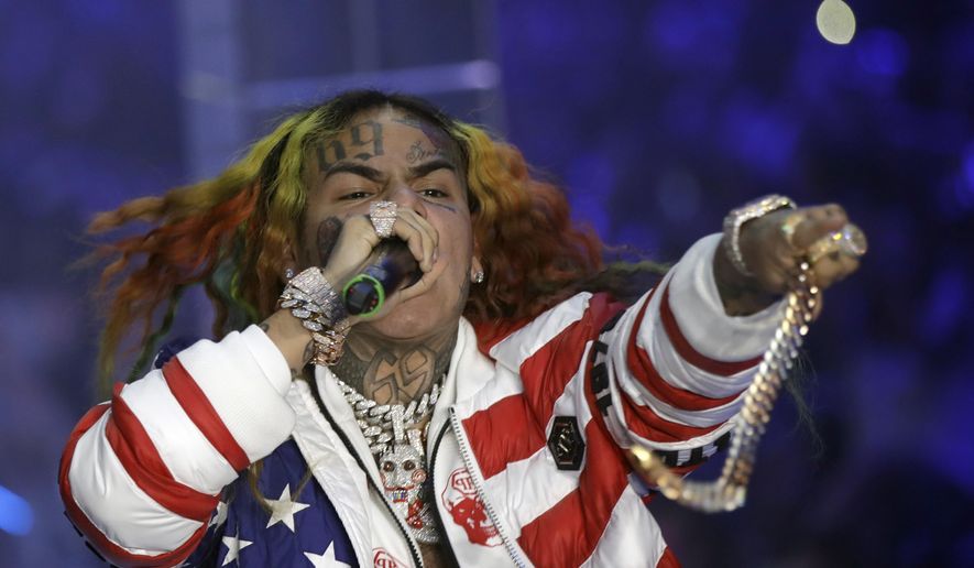 In this Sept. 21, 2018, file photo rapper Daniel Hernandez, known as Tekashi 6ix9ine, performs during the Philipp Plein women&#x27;s 2019 Spring-Summer collection, unveiled during the Fashion Week in Milan, Italy. Tekashi 6ix9ine was sentenced to two years in prison Wednesday, Dec. 18, 2019, for his entanglement with a violent street gang that fueled his rise to fame but was spared a much harsher possible sentence because of his extraordinary decision to become a star witness for prosecutors. (AP Photo/Luca Bruno, File)