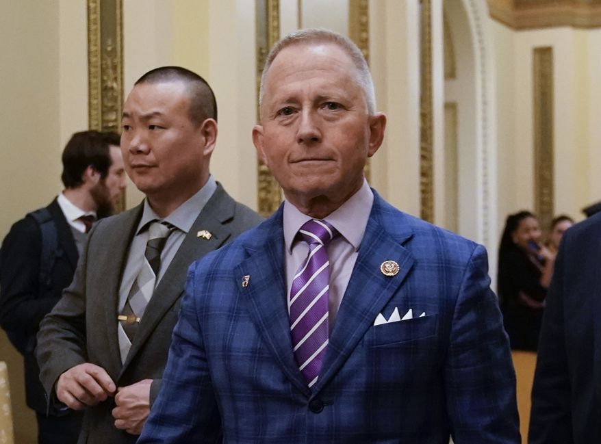 Rep. Jeff Van Drew of New Jersey departs after the House of Representatives voted to impeach President Donald Trump on two charges, abuse of power and obstruction of Congress, at the Capitol in Washington, Wednesday, Dec. 18, 2019. Van Drew, a Democrat who plans to switch and become a Republican, represents a southern New Jersey district that Trump carried in 2016 and was expected to face a difficult reelection next year. (AP Photo/J. Scott Applewhite)