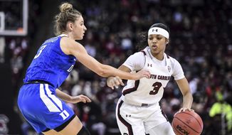 South Carolina guard Destanni Henderson, right, is defended by Duke guard Miela Goodchild during the first half of an NCAA college basketball game Thursday, Dec. 19, 2019, in Columbia, S.C. (AP Photo/Sean Rayford)