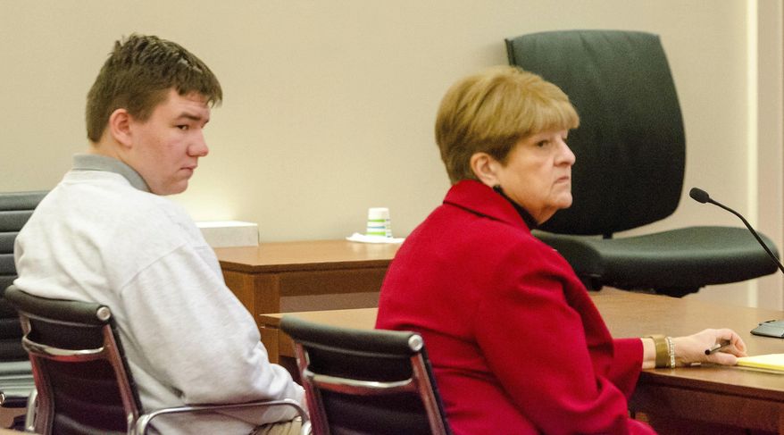 Lukas Mironovas, left, and defense attorney Pamela Ames appear in court during sentencing hearing on Thursday Dec. 19, 2019, at Capital Judicial Center in Augusta, Maine. Mironovas has been convicted of killing his mother after an argument about missing marijuana. (Joe Phelan/The Kennebec Journal via AP)