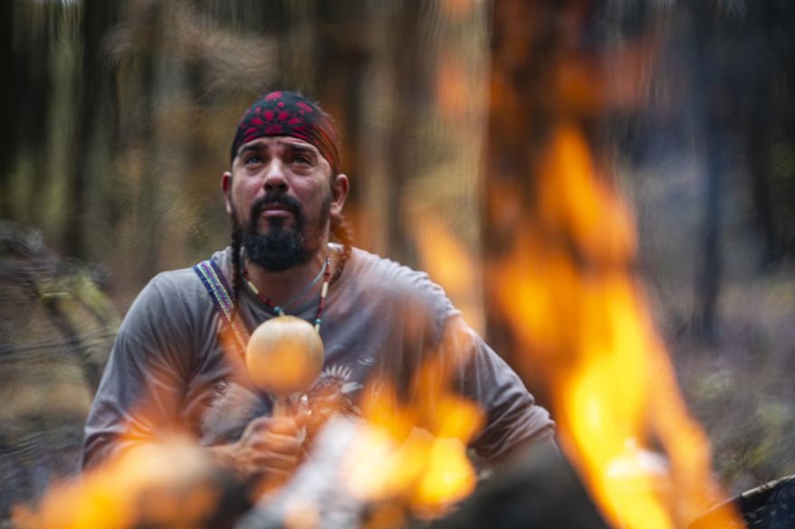 In a private moment, Bolivar prays to the spirit of his ancestors ahead of a sweat lodge ceremony in Bloomingburg, N.Y., on Sunday, Oct. 27, 2019. It was the awareness of these ancestors 11 years ago, in a sweat lodge in Colombia, that first compelled him to break his silence about the sexual abuse he suffered at the hands of his Catholic high school dean. (AP Photo/Wong Maye-E)