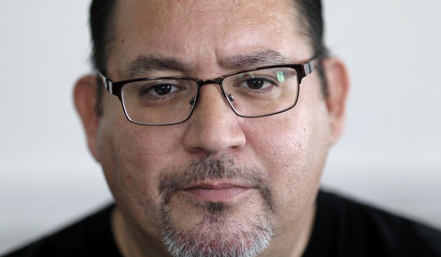 Jacob Olivas, 50, a survivor of priest abuse, poses for a portrait at home on Sunday, Sept. 29, 2019 in Rancho Cucamonga, Calif. Olivas was abused by a priest for a year when he was between the ages of 6 and 7. Still, more than four decades later, his life is difficult. (AP Photo/Wong Maye-E)