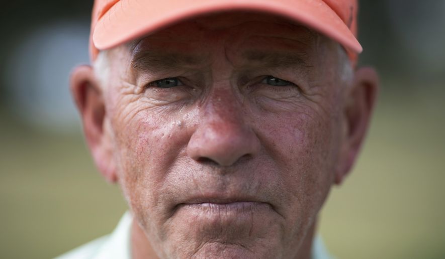 John Vai poses for a portrait on a golf course in The Villages, Fla., on Thursday, Nov. 21, 2019. Golf is part of his daily routine. Maintaining a schedule helps keep the dark memories at bay, he says. (AP Photo/Wong Maye-E)