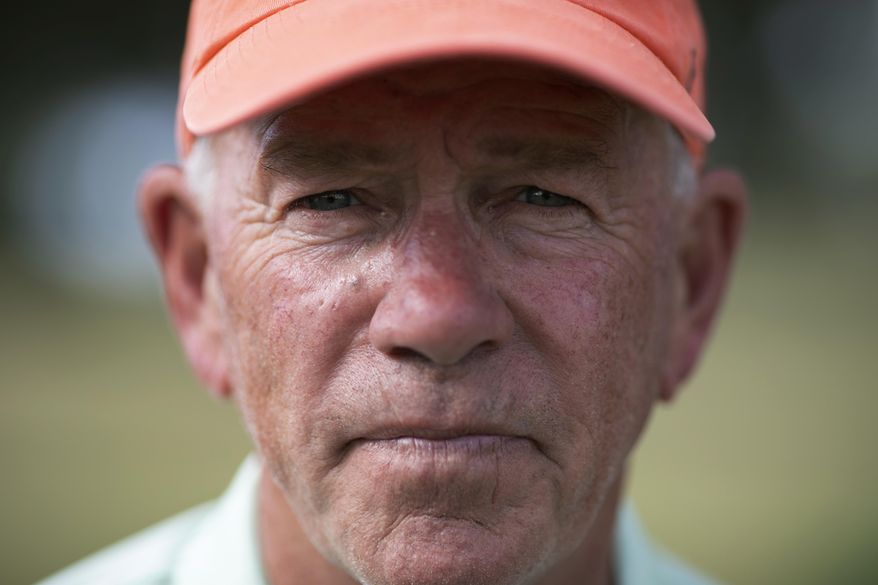 John Vai poses for a portrait on a golf course in The Villages, Fla., on Thursday, Nov. 21, 2019. Golf is part of his daily routine. Maintaining a schedule helps keep the dark memories at bay, he says. (AP Photo/Wong Maye-E)