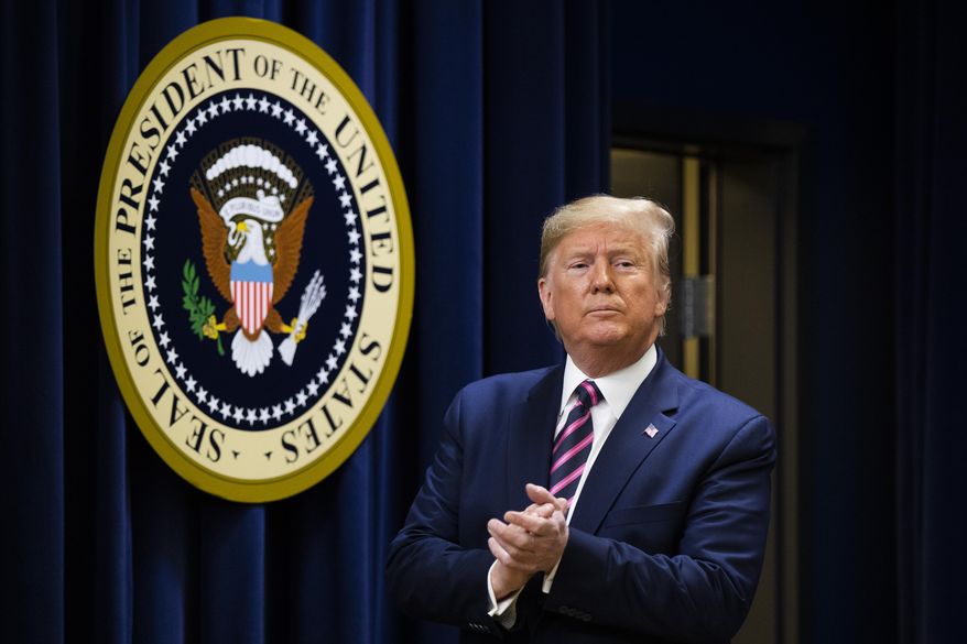 President Donald Trump acknowledges the applause during a summit on transforming mental health treatment to combat homelessness, violence, and substance abuse, at the he Eisenhower Executive Office Building on the White House complex, Thursday, Dec. 19, 2019, in Washington. (AP Photo/Manuel Balce Ceneta)