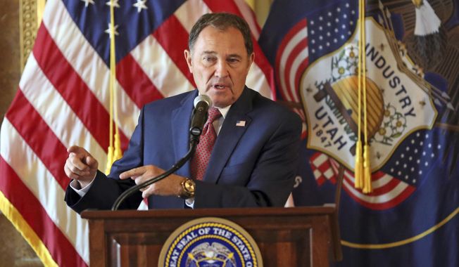 FILE - In this Sept. 12, 2018, file photo, Utah Gov. Gary Herbert speaks during a news conference at the Utah State Capitol, in Salt Lake City. Utah governor Gary Herbert has signed a sweeping overhaul of the state's tax system that lowers income tax while increasing taxes on food, fuel and several services. The Salt Lake Tribune reports Herbert defended the bill that cuts taxes by a net total of $160 million during his monthly news conference at PBS Utah. (AP Photo/Rick Bowmer, File)