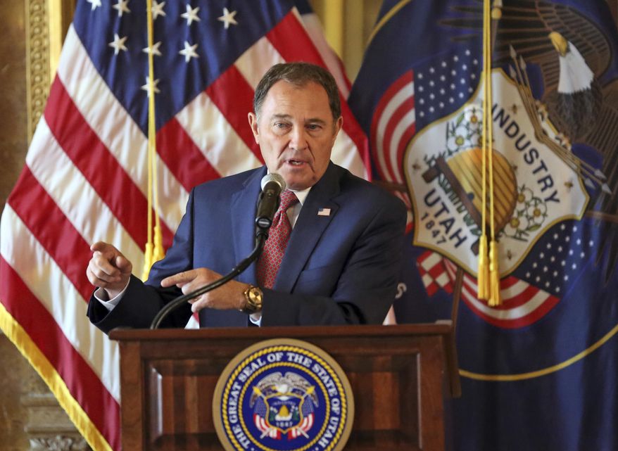 FILE - In this Sept. 12, 2018, file photo, Utah Gov. Gary Herbert speaks during a news conference at the Utah State Capitol, in Salt Lake City. Utah governor Gary Herbert has signed a sweeping overhaul of the state's tax system that lowers income tax while increasing taxes on food, fuel and several services. The Salt Lake Tribune reports Herbert defended the bill that cuts taxes by a net total of $160 million during his monthly news conference at PBS Utah. (AP Photo/Rick Bowmer, File)