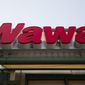 This April 2, 2015, file photo shows a Wawa convenience store in Philadelphia. The Wawa convenience store chain says a data breach may have collected debit and credit card information from thousands of customers, Thursday, Dec. 19, 2019. (AP Photo/Matt Rourke, File)