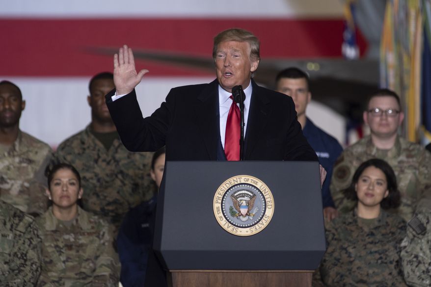 President Donald Trump speaks before signing the National Defense Authorization Act for Fiscal Year 2020 at Andrews Air Force Base, Md., Friday, Dec. 20, 2019, before traveling to Mar-a-lago in Palm Beach, Fla. (AP Photo/Kevin Wolf)