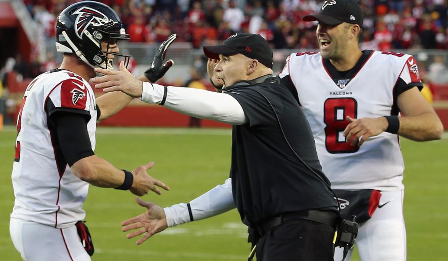 Atlanta Falcons head coach Dan Quinn, center, celebrates with quarterbacks Matt Ryan, left, and Matt Schaub (8) during the second half of an NFL football game against the San Francisco 49ers in Santa Clara, Calif., Sunday, Dec. 15, 2019. (AP Photo/John Hefti)