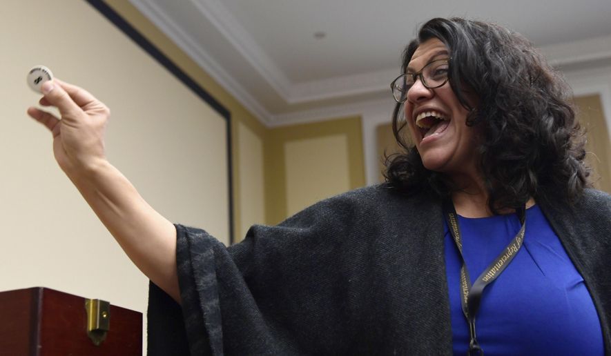 In this Monday, Dec. 9, 2019 file photo, Rep.-elect Rashida Tlaib, D-Mich., reacts after drawing her number during the Member-elect room lottery draw on Capitol Hill in Washington. Tlaib drew 8 out of 85, which determines the order in which she gets to select her new Capitol Hill office. Ms. Tlaib easily claimed the Democratic nomination for her House seat in the August 4, 2020 Democratic primary, easily defeating a challenge from a Detroit city councilwoman. (AP Photo/Susan Walsh)