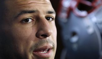 HOLD FOR STORY BY WILLIAM J. KOLE — FILE - In this Sept. 5, 2012 file photo, New England Patriots tight end Aaron Hernandez speaks in the locker room at Gillette Stadium in Foxborough, Mass. More than two years after he hanged himself in his prison cell in April 2017, while serving a life sentence for a 2013 murder, Netflix is releasing &amp;quot;Killer Inside: The Mind of Aaron Hernandez&amp;quot; on Jan. 15, 2020. Hernandez&#39;s suicide came just a days after he was acquitted of most charges in another double murder case. (AP Photo/Elise Amendola, File)