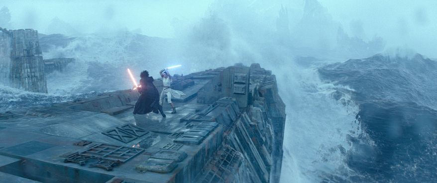 This image released by Lucasfilm shows Adam Driver as Kylo Ren, left, and Daisy Ridley as Rey in a scene from "Star Wars: The Rise of Skywalker." (Lucasfilm via AP)
