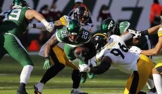 New York Jets running back Le&#39;Veon Bell (26) dives with ball in front of Pittsburgh Steelers defensive tackle Isaiah Buggs (96) during the first half of an NFL football game, Sunday, Dec. 22, 2019, in East Rutherford, N.J. (AP Photo/Seth Wenig)