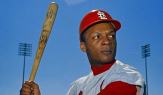 File-This 1968 file photo shows St. Louis Cardinals outfielder Curt Flood. Flood set off the free-agent revolution 50 years ago Tuesday, Dec. 24, 2019, with a 128-word  letter to baseball Commissioner Bowie Kuhn, two paragraphs that pretty much ended the career of a World Series champion regarded as among the sport&#39;s stars but united a union behind his cause. (AP Photo/File)