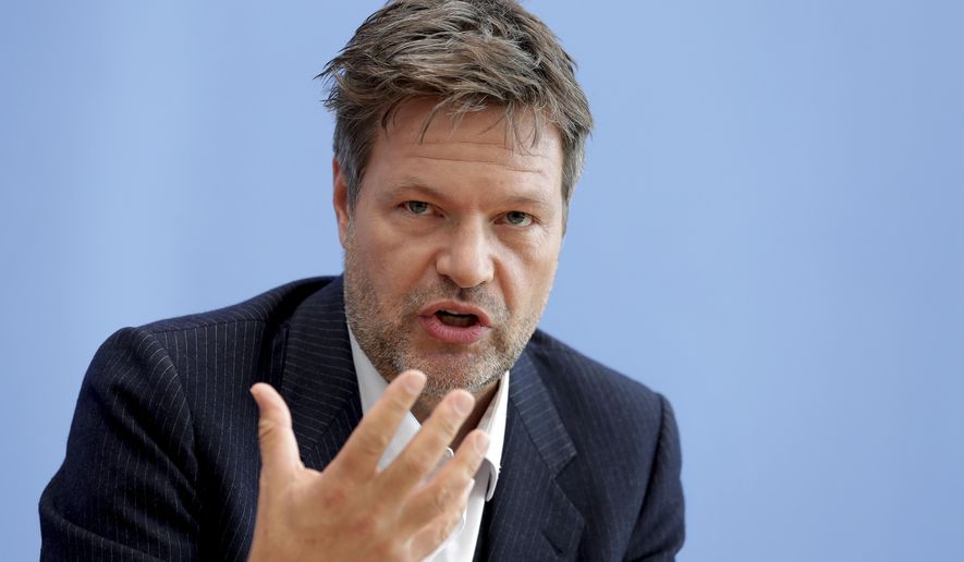 FILE - In this Monday, Oct. 28, 2019 file photo Green party co-chairman Robert Habeck addresses the media during a press conference in Berlin, Germany. Habeck said in an interview with Sunday's Frankfurter Allgemeine Sonntagszeitung newspaper that “it is an imperative of humanity to help quickly” and get some 4,000 children out of the camps on Greek islands. (AP Photo/Michael Sohn, file)