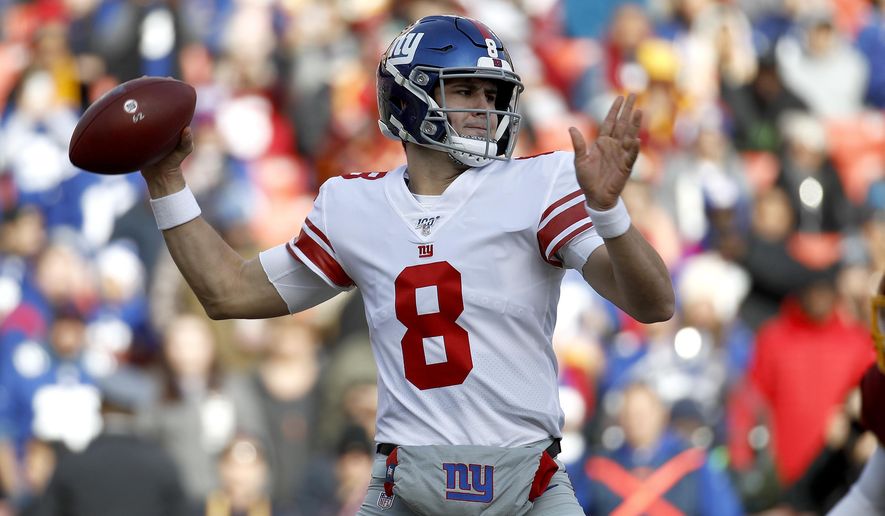 New York Giants quarterback Daniel Jones looks to pass against the Washington Redskins during the first half of an NFL football game, Sunday, Dec. 22, 2019, in Landover, Md. (AP Photo/Patrick Semansky)