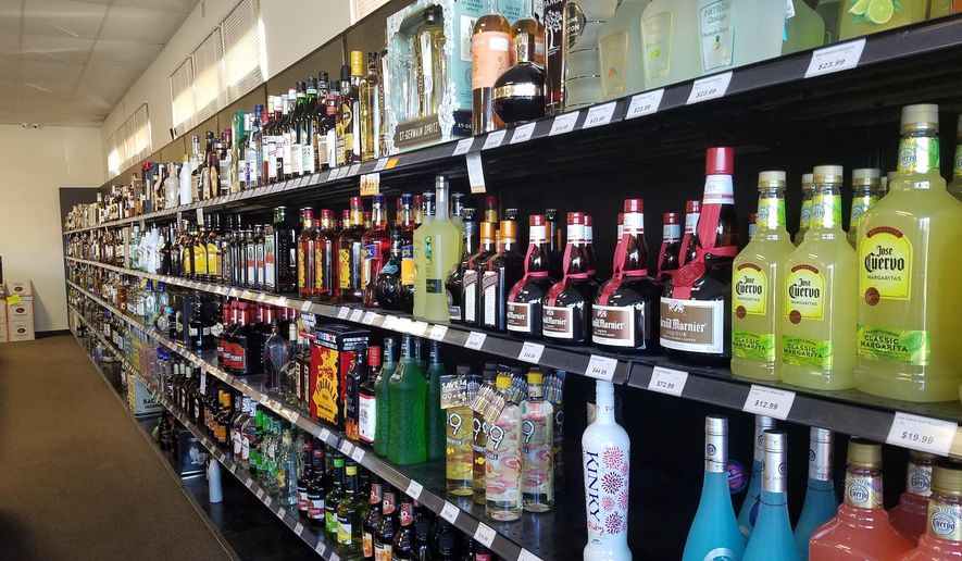 This Wednesday, Nov. 28, 2019 shows liquor bottles in Eddie's Liquor in Edmond, Okla. Voters in Oklahoma's largest county will join those in six other counties in deciding whether liquor stores can be open on Sundays. (AP Photo Ken Miller)