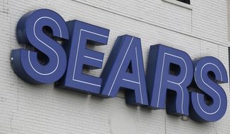 In this Oct. 15, 2018, file photo, a Sears sign is seen in Hackensack, N.J. Sears says it sold the DieHard car battery brand to Advance Auto Parts for $200 million, as the struggling retailer seeks to raise cash. Advance Auto Parts says it will sell DieHard auto batteries in its more than 4,800 stores. (AP Photo/Seth Wenig, File)
