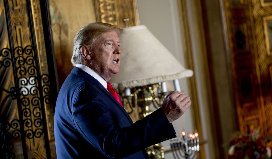 President Donald Trump speaks to members of the media following a Christmas Eve video teleconference with members of the military at his Mar-a-Lago estate in Palm Beach, Fla., Tuesday, Dec. 24, 2019. (AP Photo/Andrew Harnik) ** FILE **