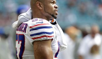 FILE - In this Dec. 2, 2018, file photo Buffalo Bills outside linebacker Lorenzo Alexander (57) looks up from the sidelines, during the first half of an NFL football game against the Miami Dolphins in Miami Gardens, Fla. Vowing to retire after this season, the 13-year NFL veteran knows Sunday&#39;s regular-season finale against the New York Jets won&#39;t be his final game for the playoff-bound Bills. (AP Photo/Lynne Sladky, File)