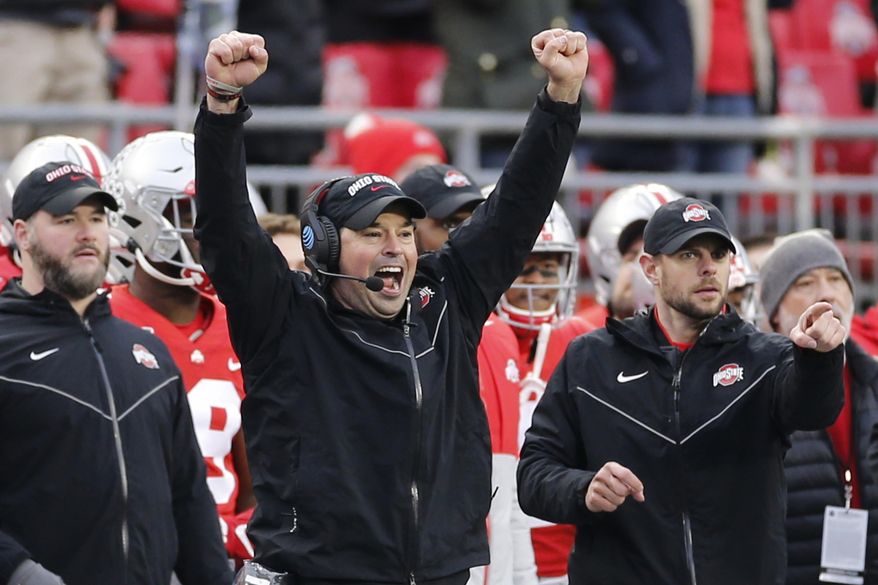 In this Nov. 23, 2019, file photo, Ohio State head coach Ryan Day celebrates on the sideline during an NCAA college football game against Penn State in Columbus, Ohio.  A year ago, Day was a relatively unknown Ohio State assistant. This December he&#39;s reigning Big Ten coach of the year and is eyeing a national title after leading the Buckeyes to a 13-0 record as the successor to the retiring Urban Meyer. (AP Photo/Jay LaPrete, File)  **FILE**