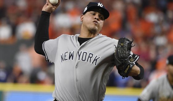 FILE - In this Oct. 20, 2017, file photo, New York Yankees relief pitcher Dellin Betances throws during the eighth inning of Game 6 of baseball&#39;s American League Championship Series against the Houston Astros in Houston. The New York Mets have reached an agreement with free-agent reliever Betances on a one-year contract with a player option for 2021. The Mets announced the deal with four-time All Star on Tuesday, Dec. 24, 2019. (AP Photo/Eric Christian Smith, File)
