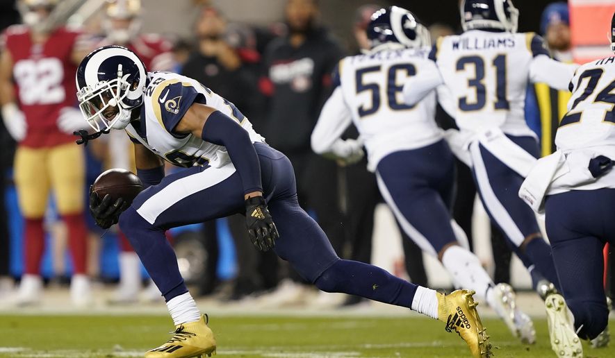 Los Angeles Rams cornerback Jalen Ramsey runs after intercepting a San Francisco 49ers pass during the first half of an NFL football game in Santa Clara, Calif., Saturday, Dec. 21, 2019. (AP Photo/Tony Avelar)