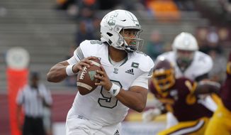 FILE - In a Saturday, Oct. 5, 2019 file photo, Eastern Michigan quarterback Mike Glass III looks to throw against Central Michigan during an NCAA football game in Mount Pleasant, Mich. Pittsburgh and Eastern Michigan will meet in the Quick Lane Bowl, on Dec. 26, 2019, hoping to end postseason droughts.  (AP Photo/Al Goldis, File)