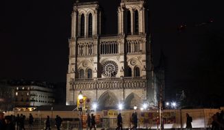 Notre Dame cathedral is pictured in Paris, Tuesday, Dec. 24, 2019. Notre Dame Cathedral is unable to host Christmas services for the first time since the French Revolution, because the Paris landmark was too deeply damaged by this year&#39;s fire. (AP Photo/Thibault Camus)