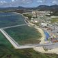 FILE - This Aug. 2018, file aerial photo shows preliminary construction work off Henoko, in Nago city, Okinawa prefecture, Japan, where the Japanese government plans to relocate a U.S. air base from one area of Okinawa&#39;s main island to another. A construction needed to improve the fragile structure underneath of a planned relocation site for a U.S. Marine Corps. base on Okinawa is to require twice as much time and cost than the previous estimate, adding more than a decade to the plan that has already been delayed for more than 20 years. The Defense Ministry on Wednesday, Dec. 25, 2019, said its latest estimate now shows that a relocation of the U.S. Marine Corps. (Koji Harada/Kyodo News via AP, File)