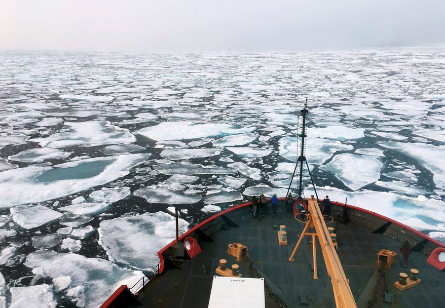 This summer 2018 file photo provided by the National Oceanic and Atmospheric Administration shows the U.S. Coast Guard Icebreaker Healy on a research cruise in the Chukchi Sea of the Arctic Ocean. (Devin Powell/NOAA via AP, File)