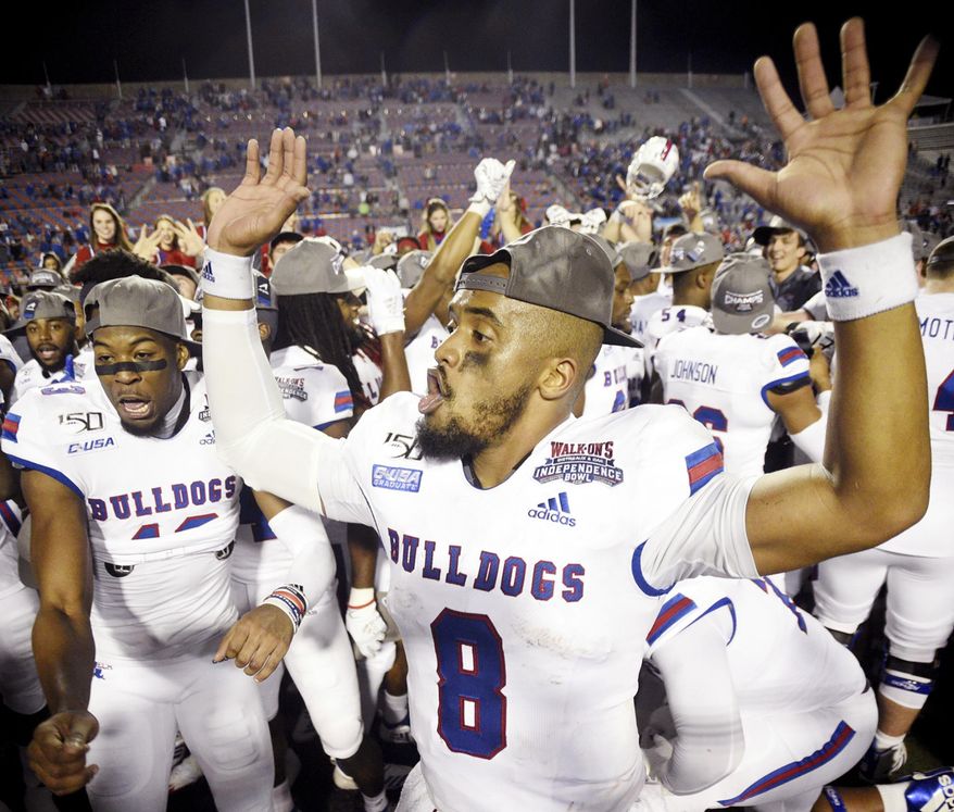 Louisiana Tech's J'Mar Smith celebrates with teammates after winning the NCAA college football Independence Bowl against Miami, Thursday, Dec. 26, 2019, at Independence Stadium in Shreveport, La. (Henriette Wildsmith/The Shreveport Times via AP)
