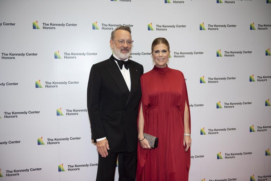 2014 Kennedy Center Honoree Tom Hanks and his wife, Rita Wilson, arrive at the State Department for the Kennedy Center Honors State Department Dinner on Saturday, Dec. 7, 2019, in Washington. (AP Photo/Kevin Wolf) ** FILE **