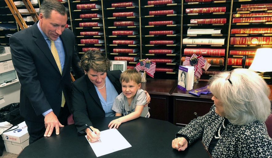 Amy McGrath officially files papers to challenge Senate Majority Leader Mitch McConnell, Friday, Dec. 27, 2019 in Frankfurt, Ky. Calling her party&#39;s victory in the Kentucky governor&#39;s race a jolt of momentum for her own bid to unseat a Republican incumbent, Democrat Amy McGrath on Friday officially filed to challenge Senate Majority Leader Mitch McConnell in what looms as a bruising, big-spending campaign next year. (AP Photo/Bruce Schreiner)