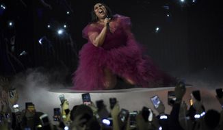 FILE - This Nov. 24, 2019 file photo shows Lizzo performing &amp;quot;Jerome&amp;quot; at the American Music Awards in Los Angeles. Lizzo has been named Entertainer of the Year by The Associated Press. Voted by entertainment staffers of the news cooperative, Lizzo dominated the pop, R&amp;amp;B and rap charts in 2019 with songs like “Truth Hurts&amp;quot; and “Good As Hell.&amp;quot; Though she released her first album in 2013, Lizzo dropped her major-label debut, “Cuz I Love You,” this year and the success has made her the leading nominee at the 2020 Grammy Awards, where she is up for eight honors. (Photo by Chris Pizzello/Invision/AP, FIle)
