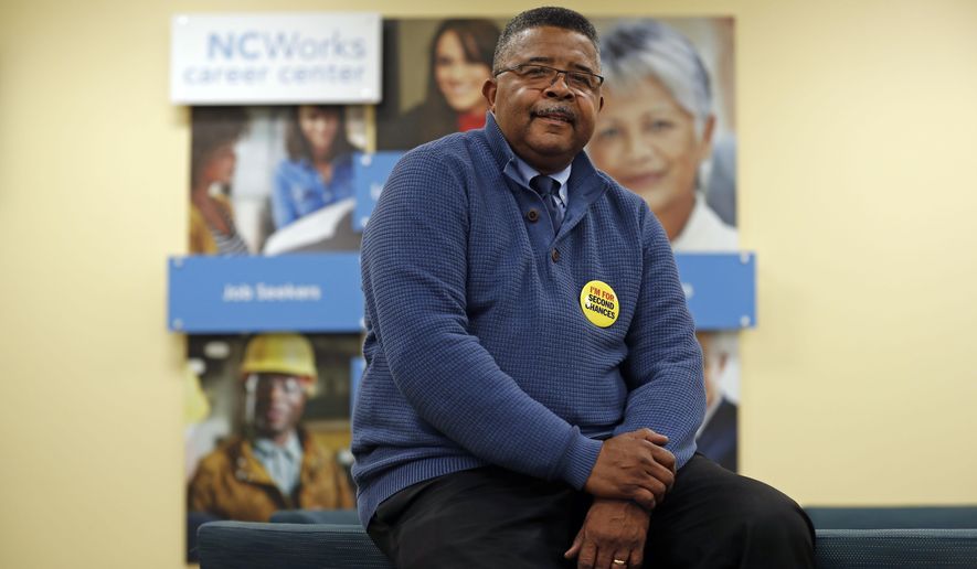 In this photo taken Wednesday, Dec. 18, 2019 Dennis Gaddy, the co-founder of Community Success Initiative is seen in the Raleigh, N.C. office. Gaddy, 62, served time behind bars and said he was unable to vote for seven years after being released from prison because he was on probation. (AP Photo/Gerry Broome)