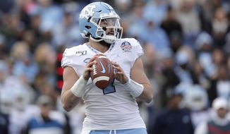 North Carolina quarterback Sam Howell looks to pass against Temple during the first half of the Military Bowl NCAA college football game, Friday, Dec. 27, 2019, in Annapolis, Md. (AP Photo/Julio Cortez)