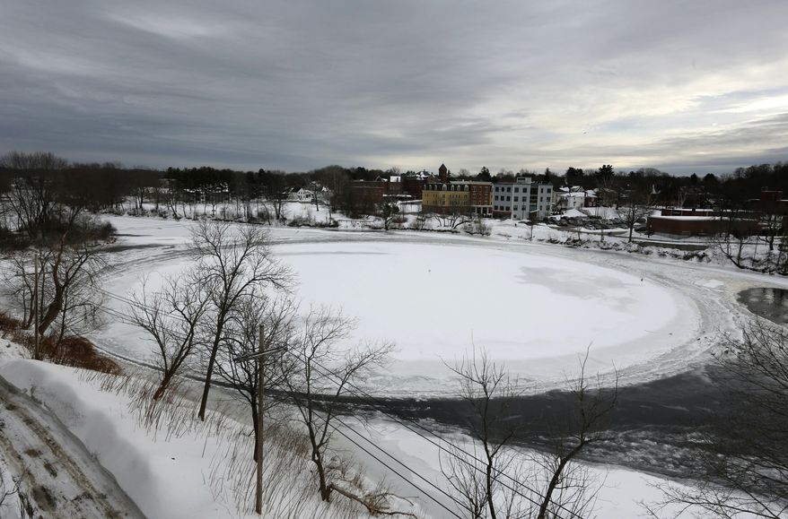 FILE - In this Jan. 23, 2019 file photo, a naturally occurring, slowly spinning ice disk the width of a football field floats in the Presumpscot River in Westbrook, Maine. The story of the rotating frozen is among some of 2019&#x27;s weirder stories in New England. (AP Photo/Robert F. Bukaty, File)