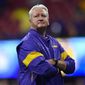 LSU Offensive Coordinator Steve Ensminger watches teams warm up before the first half of the Peach Bowl NCAA semifinal college football playoff game between LSU and Oklahoma, Saturday, Dec. 28, 2019, in Atlanta. Ensminger&#39;s daughter-in-law, Carley McCord, died in a plane crash Saturday in Louisiana on the way to the game. (AP Photo/John Amis)