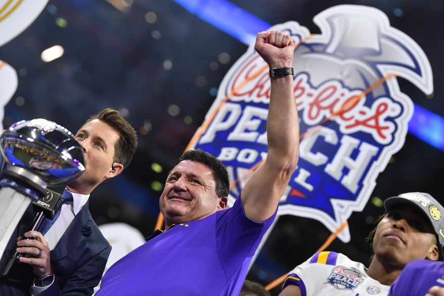 LSU head coach Ed Orgeron celebrates after the team's Peach Bowl NCAA semifinal college football playoff game against Oklahoma, Saturday, Dec. 28, 2019, in Atlanta. LSU won 63-28. (AP Photo/John Amis)