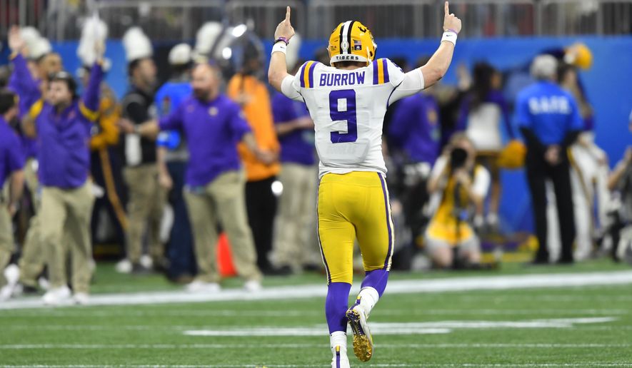 LSU quarterback Joe Burrow (9) celebrates a touchdown against Oklahoma during the first half of the Peach Bowl NCAA semifinal college football playoff game, Saturday, Dec. 28, 2019, in Atlanta. (AP Photo/John Amis)
