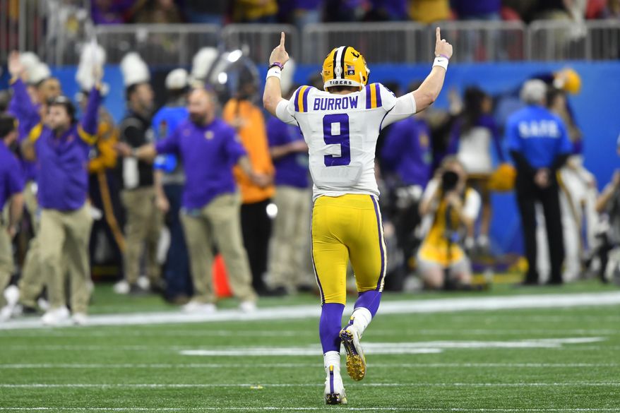 LSU quarterback Joe Burrow (9) celebrates a touchdown against Oklahoma during the first half of the Peach Bowl NCAA semifinal college football playoff game, Saturday, Dec. 28, 2019, in Atlanta. (AP Photo/John Amis)