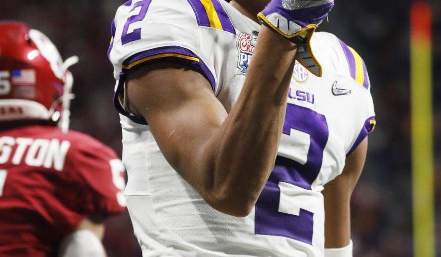 LSU wide receiver Justin Jefferson (2) celebrates a touchdown catch against Oklahoma during the first half of the Peach Bowl NCAA semifinal college football playoff game, Saturday, Dec. 28, 2019, in Atlanta.(AP Photo/John Bazemore)
