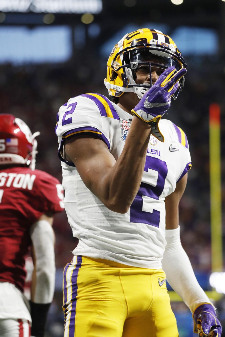 LSU wide receiver Justin Jefferson (2) celebrates a touchdown catch against Oklahoma during the first half of the Peach Bowl NCAA semifinal college football playoff game, Saturday, Dec. 28, 2019, in Atlanta.(AP Photo/John Bazemore)
