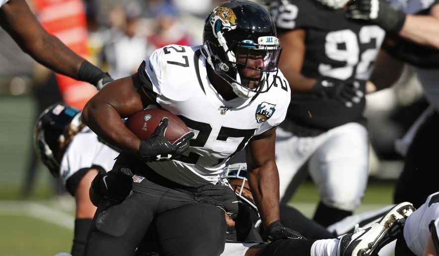 Jacksonville Jaguars running back Leonard Fournette runs with the ball during the second half of an NFL football game against the Oakland Raiders in Oakland, Calif., Sunday, Dec. 15, 2019. (AP Photo/D. Ross Cameron)