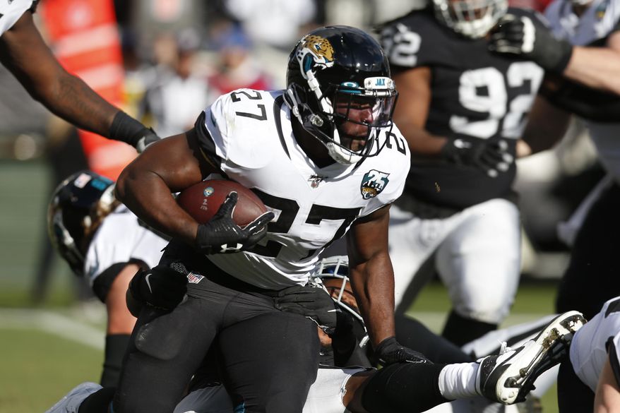 Jacksonville Jaguars running back Leonard Fournette runs with the ball during the second half of an NFL football game against the Oakland Raiders in Oakland, Calif., Sunday, Dec. 15, 2019. (AP Photo/D. Ross Cameron)